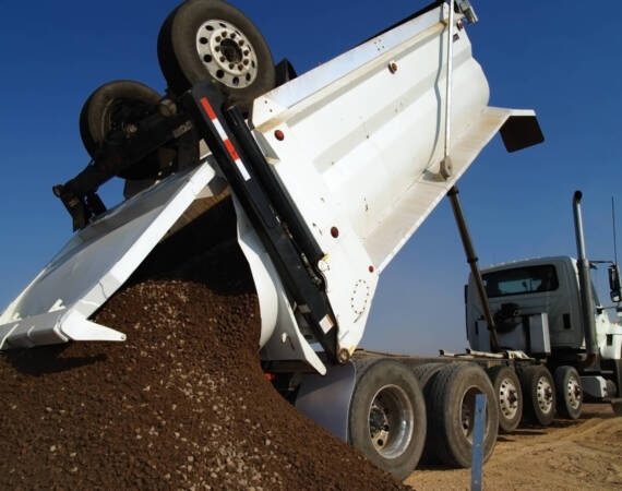 a-large-heavy-duty-dump-truck-depositing-its-load-2025-10-16-23-17-03-utc