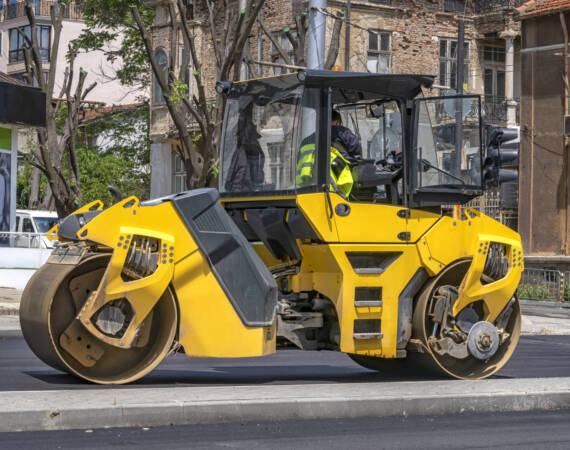 Drum roller making new road at the city. Side view