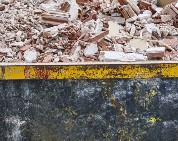 Removal of debris. Construction waste. Building demolition. Devastation background